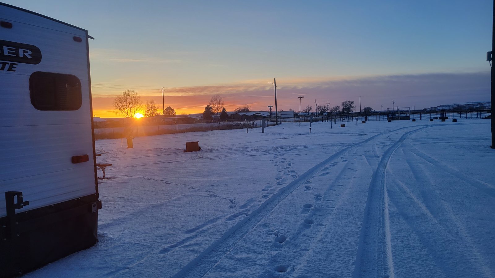 Winter sunrise over a snowy site