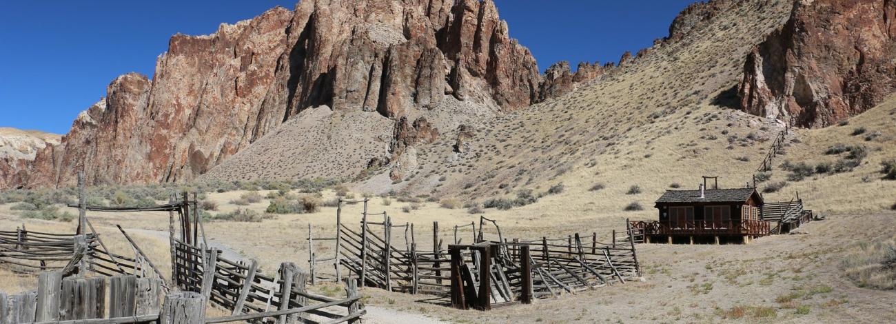 Birch Creek Historic Ranch barn below desert hills